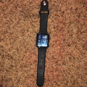 Apple Watch series 3 black with black band and an extra band including charger.